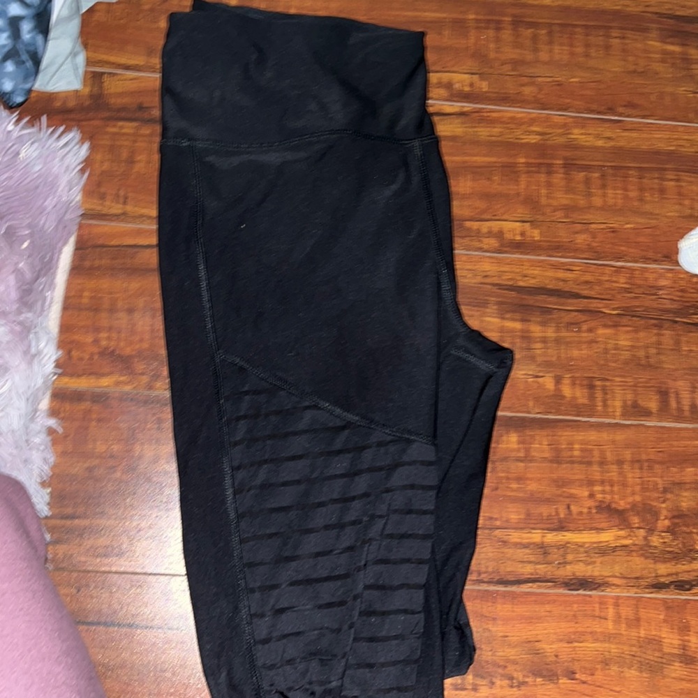 Black workout leggings with mesh cutout
